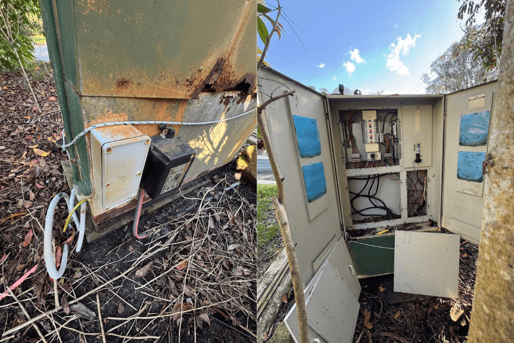 An outdoor switchboard cabinet standing open