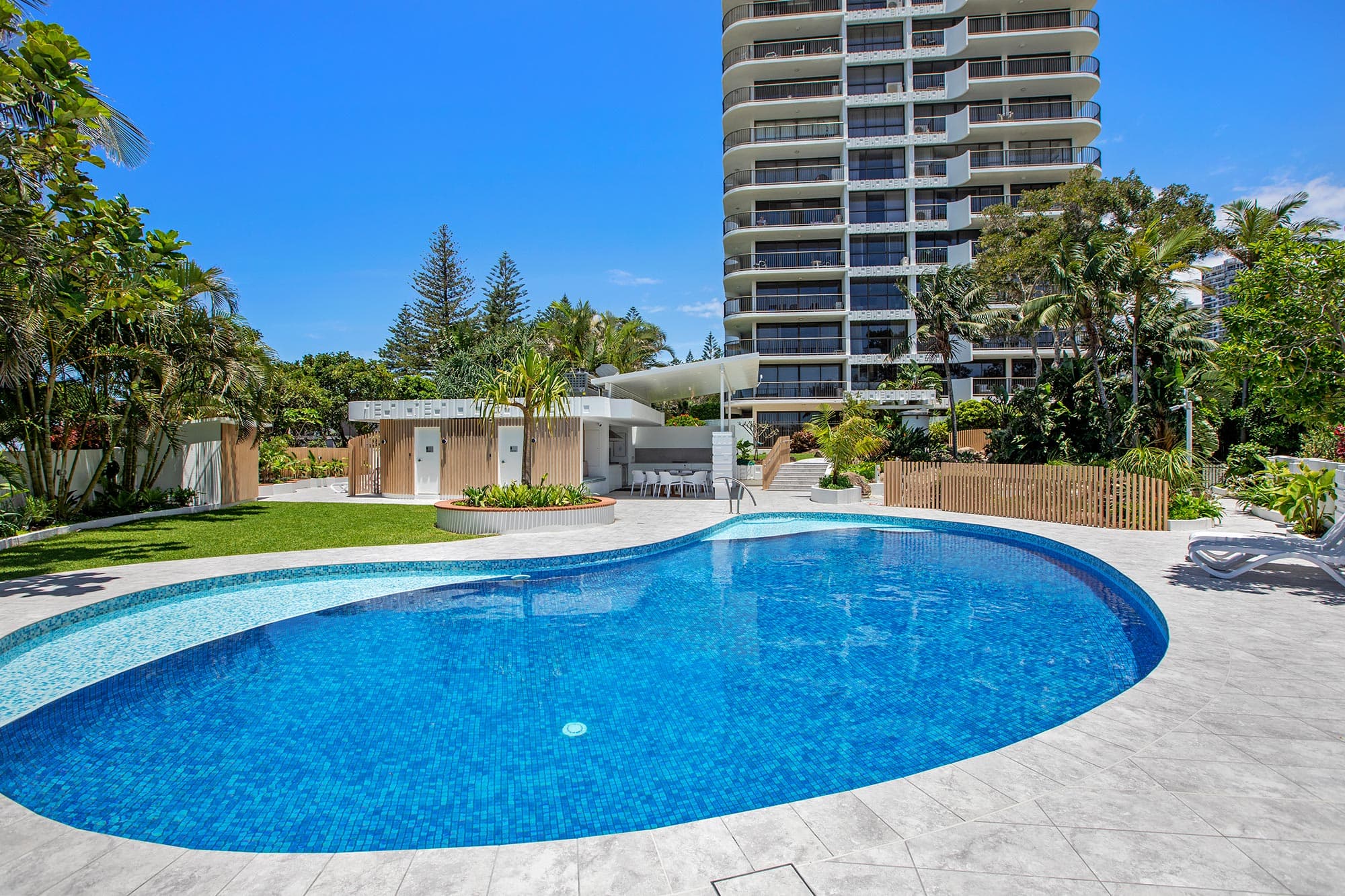The DeVille Apartments tower above the resort pool
